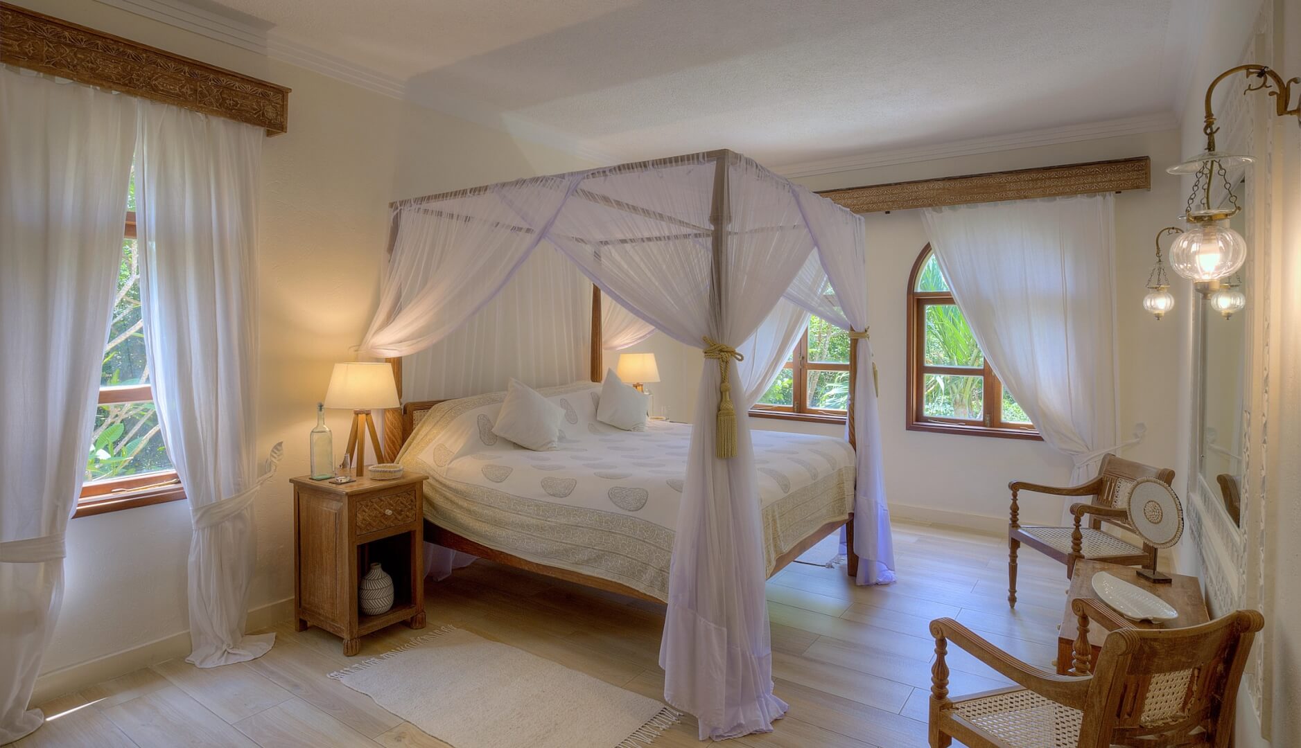 Double bedroom with canopy bed inside Almanara Garden Villa